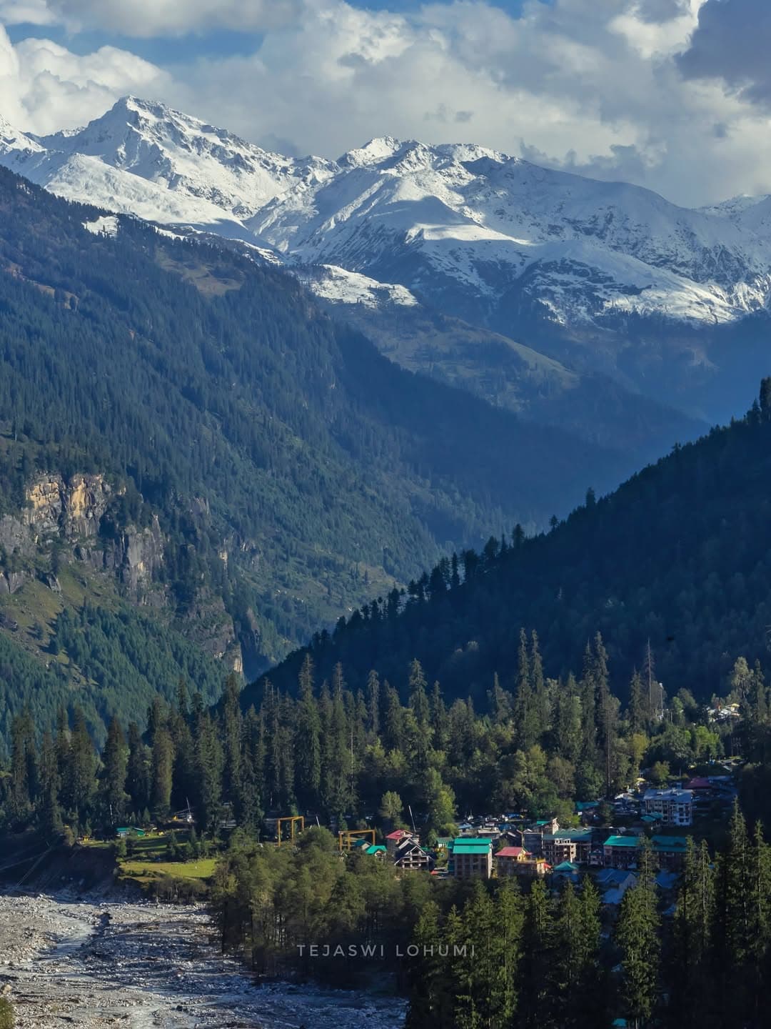 Manali mountain town with snow-capped Himalayan peaks in the background